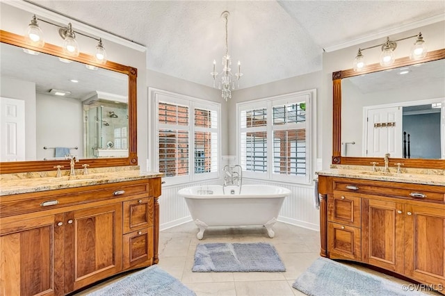 8467 Wendellshire Way, Mechanicsville, VA 23111 - full bath with a textured ceiling, a chandelier, two vanities, a shower stall, and wainscoting