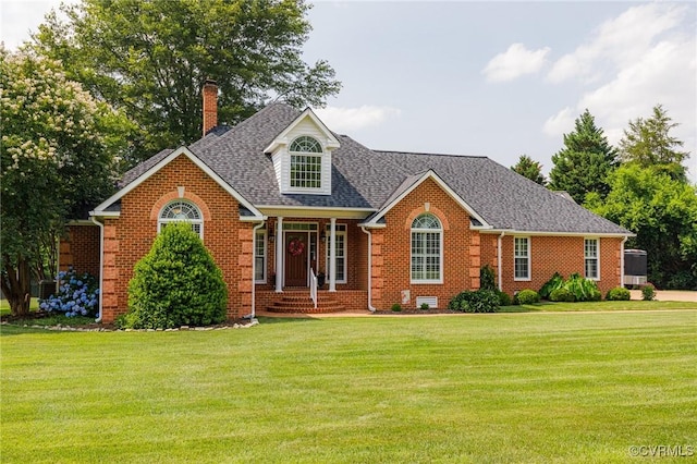 8467 Wendellshire Way, Mechanicsville, VA 23111 - view of front of home featuring brick siding, a chimney, a front yard, and roof with shingles