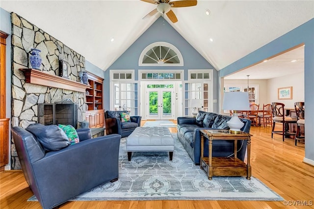 8467 Wendellshire Way, Mechanicsville, VA 23111 - living area featuring a ceiling fan, wood finished floors, high vaulted ceiling, a fireplace, and french doors