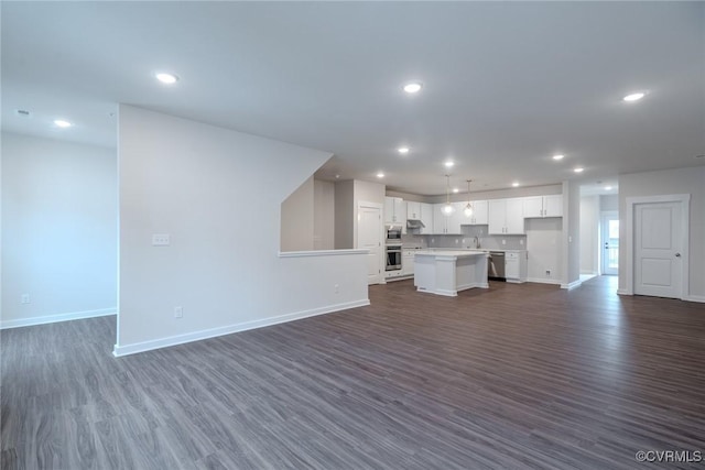 3436 Carlton St Unit 4-4A, Richmond, VA 23230 - unfurnished living room featuring dark wood-style floors and recessed lighting