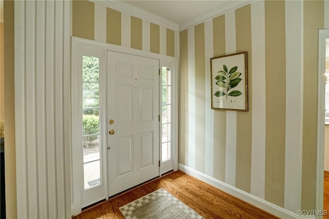 5116 Belmont Park Rd, Glen Allen, VA 23059 - foyer entrance with ornamental molding, wood finished floors, plenty of natural light, and wallpapered walls