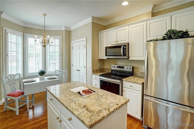 5116 Belmont Park Rd, Glen Allen, VA 23059 - kitchen featuring stainless steel appliances, light wood-style flooring, a chandelier, a kitchen island, and white cabinets