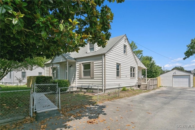 808 Penniman Rd, Williamsburg, VA 23185 - view of front facade with a gate, driveway, an outbuilding, and a detached garage