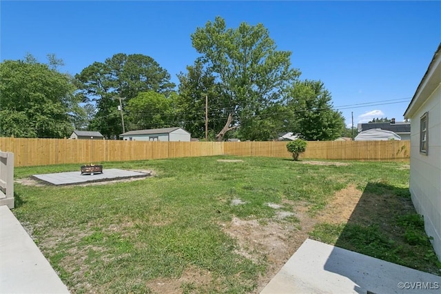 808 Penniman Rd, Williamsburg, VA 23185 - fenced backyard with a fire pit and a patio area