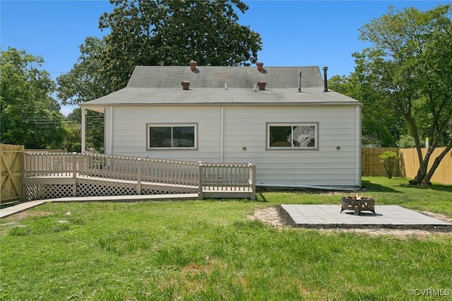 808 Penniman Rd, Williamsburg, VA 23185 - back of property with an outdoor fire pit, a fenced backyard, a deck, and a patio area