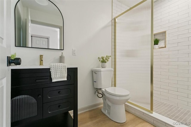 808 Penniman Rd, Williamsburg, VA 23185 - full bathroom with vanity, tiled shower, and wood finished floors