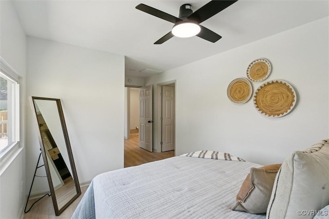 808 Penniman Rd, Williamsburg, VA 23185 - bedroom featuring light wood finished floors, multiple windows, and a ceiling fan