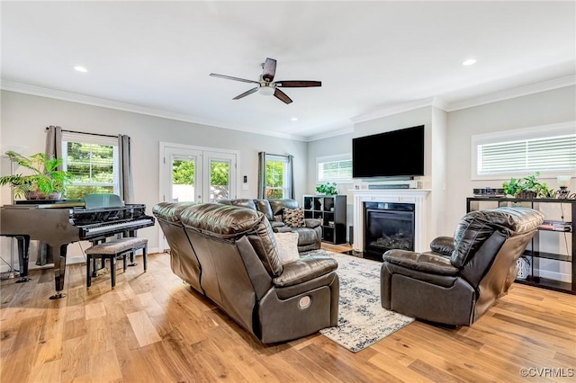 9401 Alsace Ct, Mechanicsville, VA 23116 - living room featuring a ceiling fan, light wood-style floors, a glass covered fireplace, recessed lighting, and ornamental molding