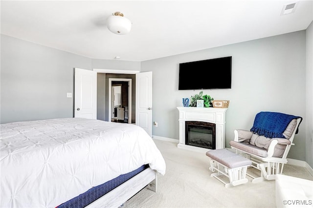 9401 Alsace Ct, Mechanicsville, VA 23116 - carpeted bedroom featuring a glass covered fireplace and baseboards