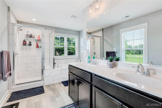 9401 Alsace Ct, Mechanicsville, VA 23116 - full bath featuring a bath, a shower stall, double vanity, wood finished floors, and recessed lighting