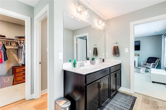 9401 Alsace Ct, Mechanicsville, VA 23116 - full bath featuring wood finished floors, double vanity, and a walk in closet