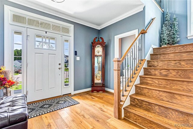 9401 Alsace Ct, Mechanicsville, VA 23116 - entryway with stairs, light wood-style floors, and crown molding