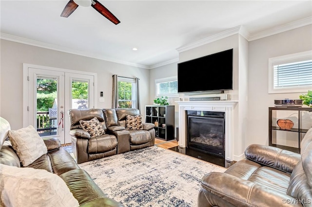 9401 Alsace Ct, Mechanicsville, VA 23116 - living area with a ceiling fan, a fireplace with flush hearth, crown molding, french doors, and wood finished floors