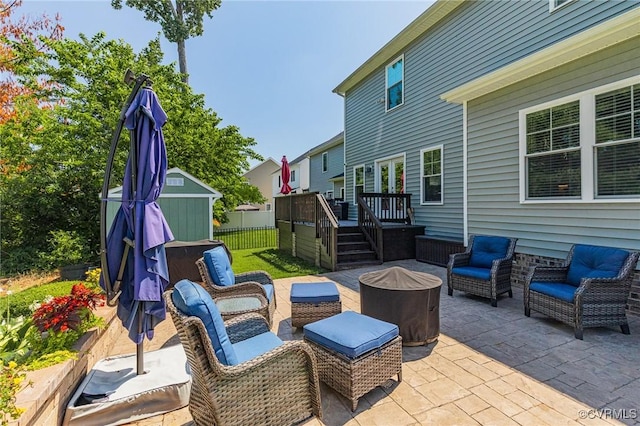 9401 Alsace Ct, Mechanicsville, VA 23116 - view of patio featuring a shed, a deck, and an outdoor living space with a fire pit