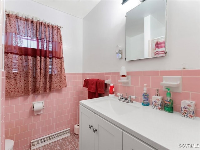 3204 Evergreen Ave, Hopewell, VA 23860 - bathroom with tile walls, vanity, and a wainscoted wall