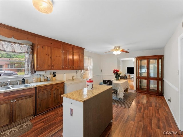 3204 Evergreen Ave, Hopewell, VA 23860 - kitchen featuring dark wood finished floors, a center island, light countertops, a ceiling fan, and brown cabinets