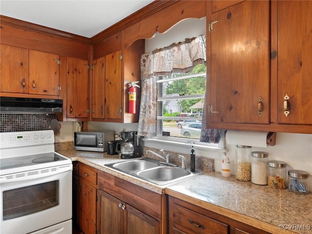 3204 Evergreen Ave, Hopewell, VA 23860 - kitchen featuring electric range, stainless steel microwave, under cabinet range hood, and brown cabinetry