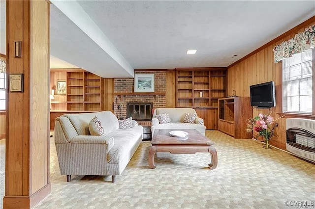 1600 Donora Ct, Henrico, VA 23229 - living area featuring a brick fireplace, wooden walls, built in shelves, and heating unit