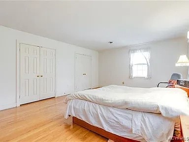 1600 Donora Ct, Henrico, VA 23229 - bedroom featuring two closets and light wood-style floors