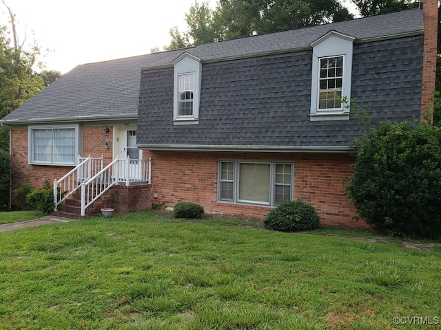 1600 Donora Ct, Henrico, VA 23229 - view of front facade featuring a shingled roof, a front lawn, brick siding, mansard roof, and a chimney