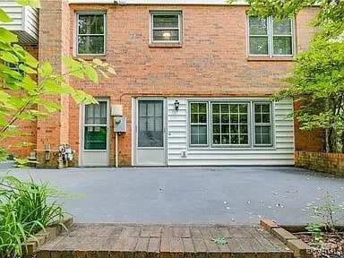 1600 Donora Ct, Henrico, VA 23229 - rear view of house featuring a patio and brick siding