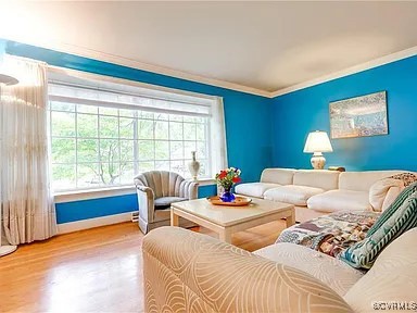 1600 Donora Ct, Henrico, VA 23229 - living room featuring crown molding, healthy amount of natural light, and wood finished floors