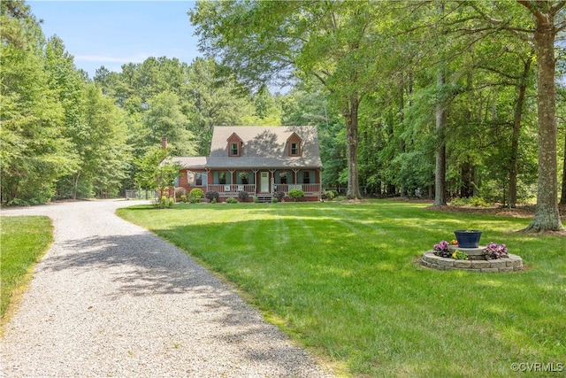 15615 Providence Rd, Prince George, VA 23805 - cape cod-style house featuring covered porch, a front yard, driveway, and a forest view