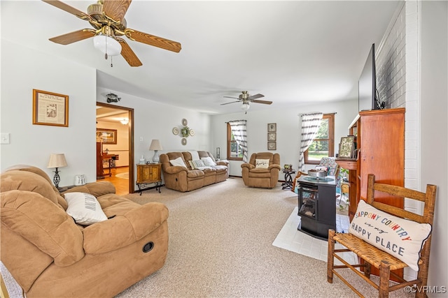 15615 Providence Rd, Prince George, VA 23805 - living room featuring a ceiling fan, carpet floors, and a wood stove
