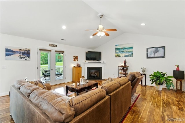112 Rosemary Ct, Tappahannock, VA 22560 - living area with vaulted ceiling, ceiling fan, wood finished floors, a glass covered fireplace, and recessed lighting