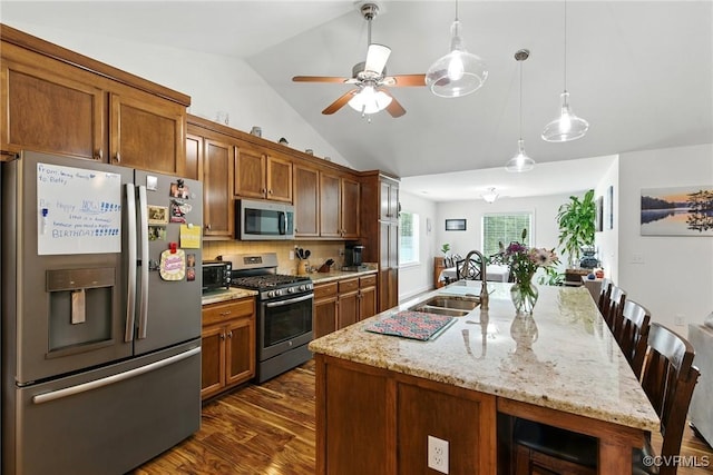 112 Rosemary Ct, Tappahannock, VA 22560 - kitchen featuring appliances with stainless steel finishes, lofted ceiling, dark wood finished floors, ceiling fan, and brown cabinetry
