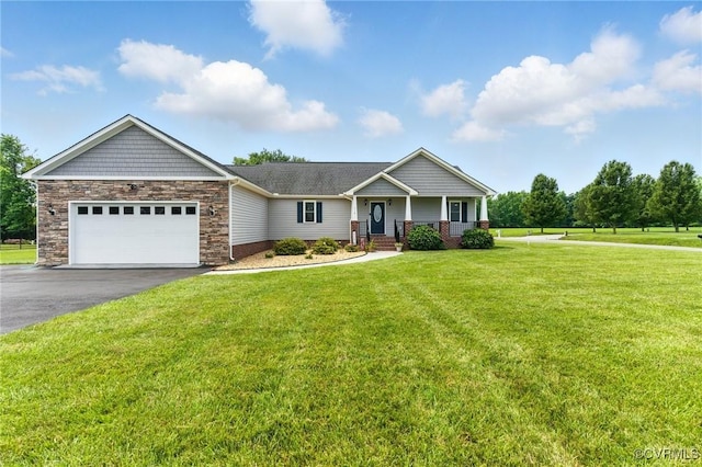 112 Rosemary Ct, Tappahannock, VA 22560 - craftsman-style house with asphalt driveway, an attached garage, a front lawn, a porch, and stone siding