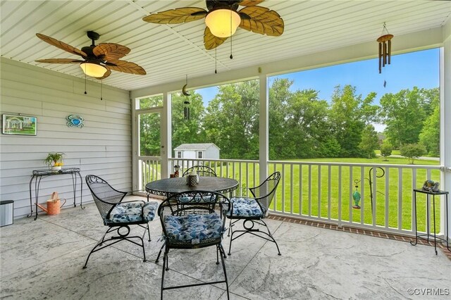 112 Rosemary Ct, Tappahannock, VA 22560 - view of patio with ceiling fan, a storage shed, outdoor dining area, and view of scattered trees