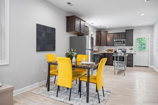 1808 N 20th St, Richmond, VA 23223 - dining space with light wood-style floors and recessed lighting