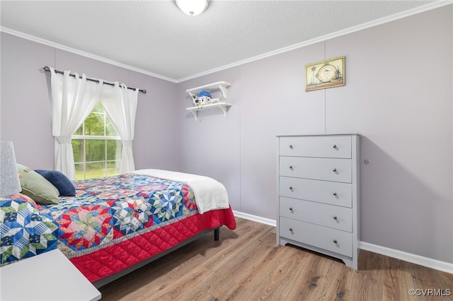 14231 Dykeland Rd, Amelia Courthouse, VA 23002 - bedroom featuring ornamental molding, wood finished floors, and a textured ceiling
