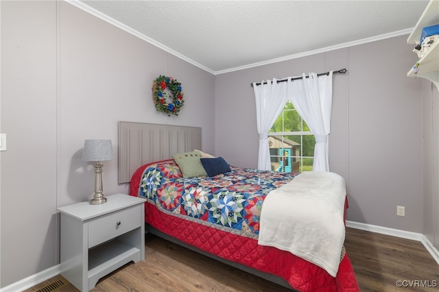 14231 Dykeland Rd, Amelia Courthouse, VA 23002 - bedroom featuring crown molding, wood finished floors, and a textured ceiling