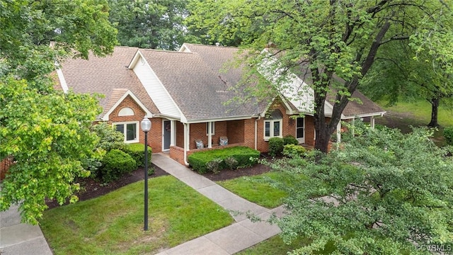 3110 Lake Shire Ct Unit 3110, Richmond, VA 23235 - view of front facade with a front lawn, brick siding, and roof with shingles