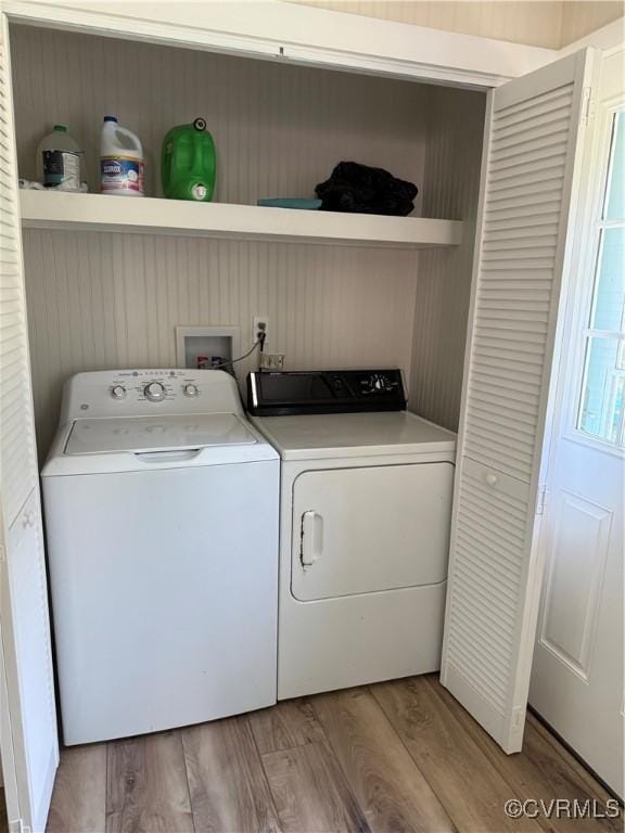 616 Long Point Ln, Topping, VA 23169 - laundry room with separate washer and dryer and light wood-type flooring