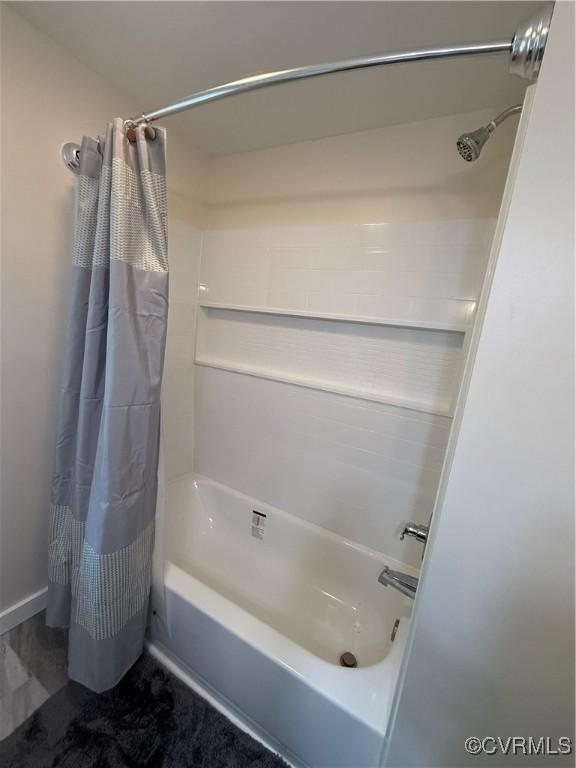 616 Long Point Ln, Topping, VA 23169 - bathroom with shower / bath combo with shower curtain