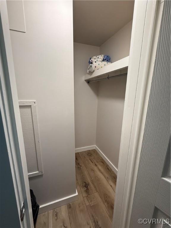 616 Long Point Ln, Topping, VA 23169 - spacious closet featuring wood finished floors