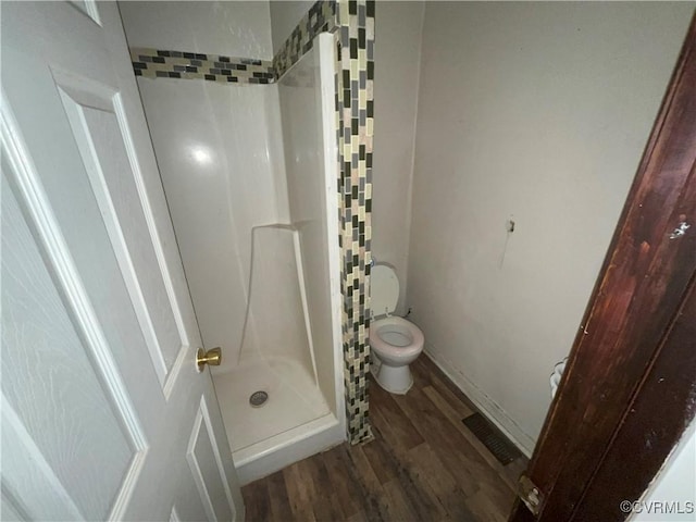511 Hannon St, Petersburg, VA 23803 - bathroom with a stall shower and wood finished floors