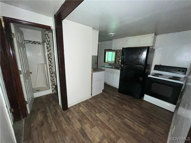 511 Hannon St, Petersburg, VA 23803 - kitchen with range with electric cooktop, freestanding refrigerator, dark wood-type flooring, and white cabinetry