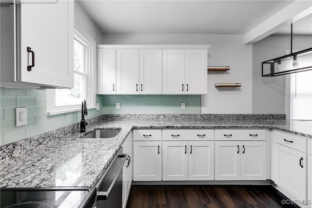 2149 Park Ln, Henrico, VA 23230 - kitchen with stainless steel dishwasher, white cabinetry, light stone countertops, dark wood finished floors, and tasteful backsplash