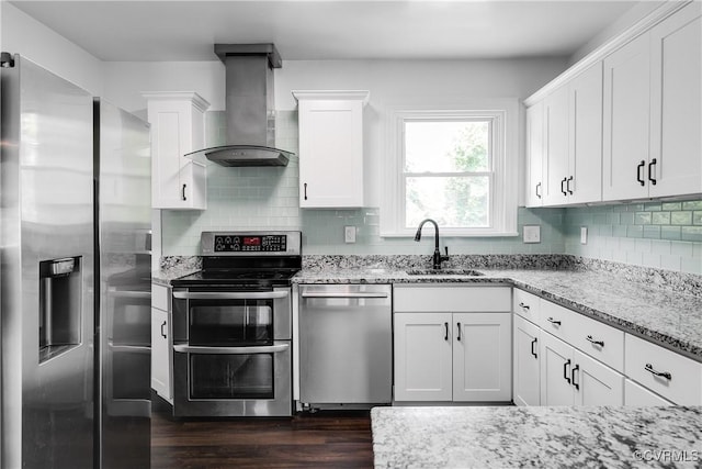 2149 Park Ln, Henrico, VA 23230 - kitchen with wall chimney exhaust hood, stainless steel appliances, dark wood-style floors, white cabinetry, and light stone countertops