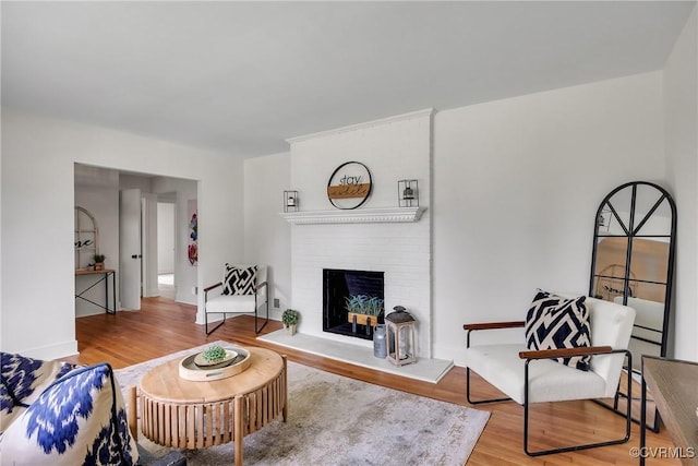 7709 Yolanda Rd, Henrico, VA 23229 - living room with wood finished floors and a brick fireplace