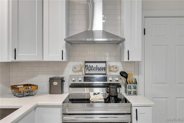 7709 Yolanda Rd, Henrico, VA 23229 - kitchen with wall chimney exhaust hood, stainless steel electric stove, white cabinetry, tasteful backsplash, and light countertops