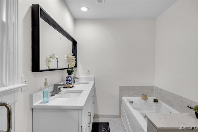 7709 Yolanda Rd, Henrico, VA 23229 - bathroom with double vanity, tile patterned floors, a garden tub, and recessed lighting