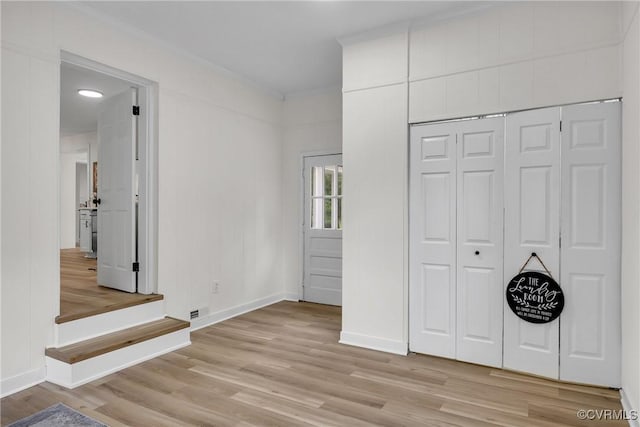 7709 Yolanda Rd, Henrico, VA 23229 - unfurnished bedroom with light wood finished floors, crown molding, and a closet