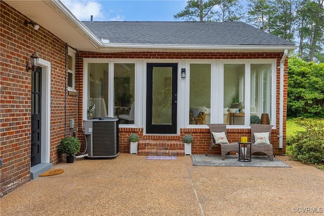 7709 Yolanda Rd, Henrico, VA 23229 - doorway to property featuring brick siding, a patio, and a shingled roof
