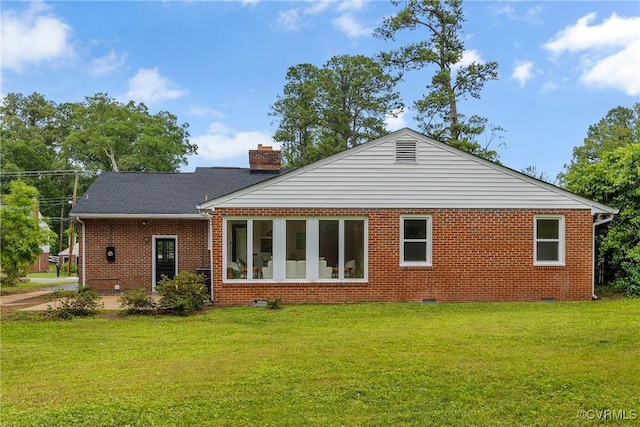 7709 Yolanda Rd, Henrico, VA 23229 - back of property with a lawn, brick siding, and a chimney