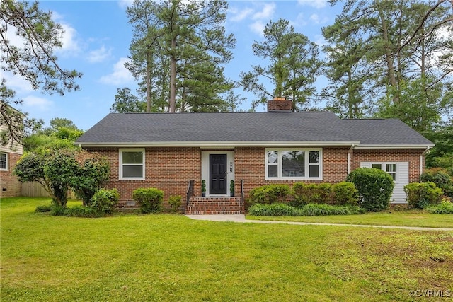 7709 Yolanda Rd, Henrico, VA 23229 - view of front of home with brick siding, a chimney, a front yard, and roof with shingles